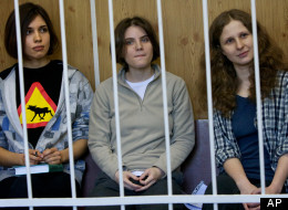 Maria Alekhina, Yekaterina Samutsevich, Nadezhda Tolokonnikova in jail. AP Photo/Alexander Zemlianichenko