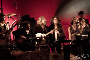 Kathy Moore & Darren Loucas on guitar, Andy Stoller on mandolin, Zachery Davidson, Jen Ayers and Sarah Rudinoff on vocals